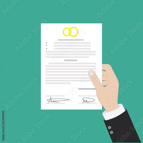 Prenuptial agreement in man and woman hands. Family and law concept