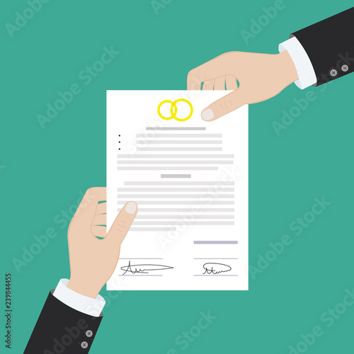 Prenuptial agreement in man and woman hands. Family and law concept