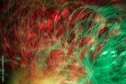 Defocused colored luminous spots and curved lines. For background