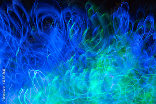Defocused colored luminous spots and curved lines. For background