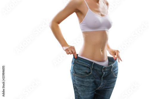     Woman is measuring waist after weight loss,. Diet concept © Igor Link