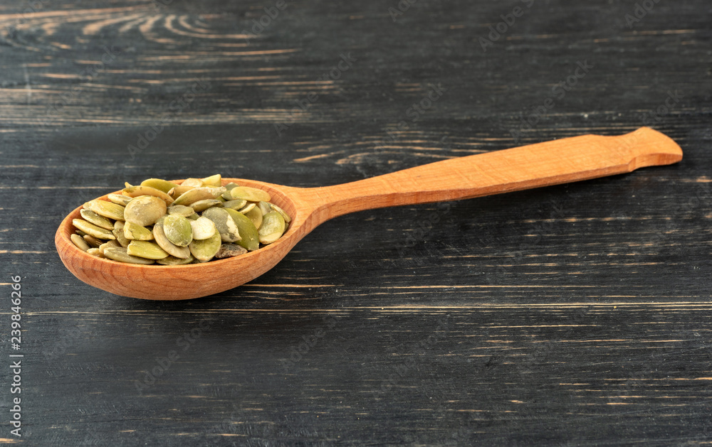 Pumpkin seed kernels in spoon Pumpkin seed kernels in spoon