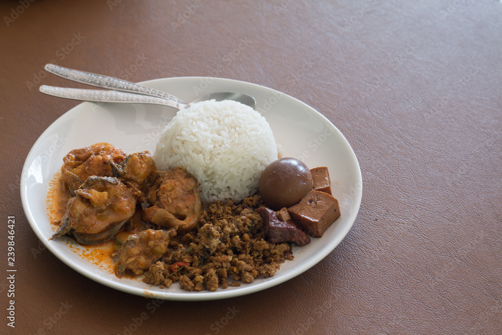 Rice with Eggs and pork in brown sauce and curry fish Rice with Eggs and pork in brown sauce and curry fish