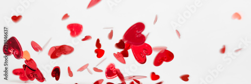 Fototapeta Naklejka Na Ścianę i Meble -  a lot of flying and falling hearts on white background. Valentine's Day. symbol of love, long banner