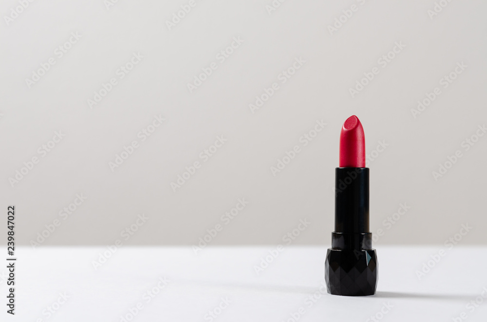 Red lipstick on white background. Copy space Red lipstick on white background. Copy space