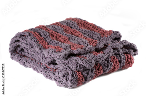 Purple and rose handcrafted crocheted afghan throw blanket isolated on a white background