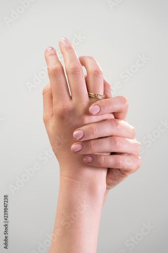 female hand against white background