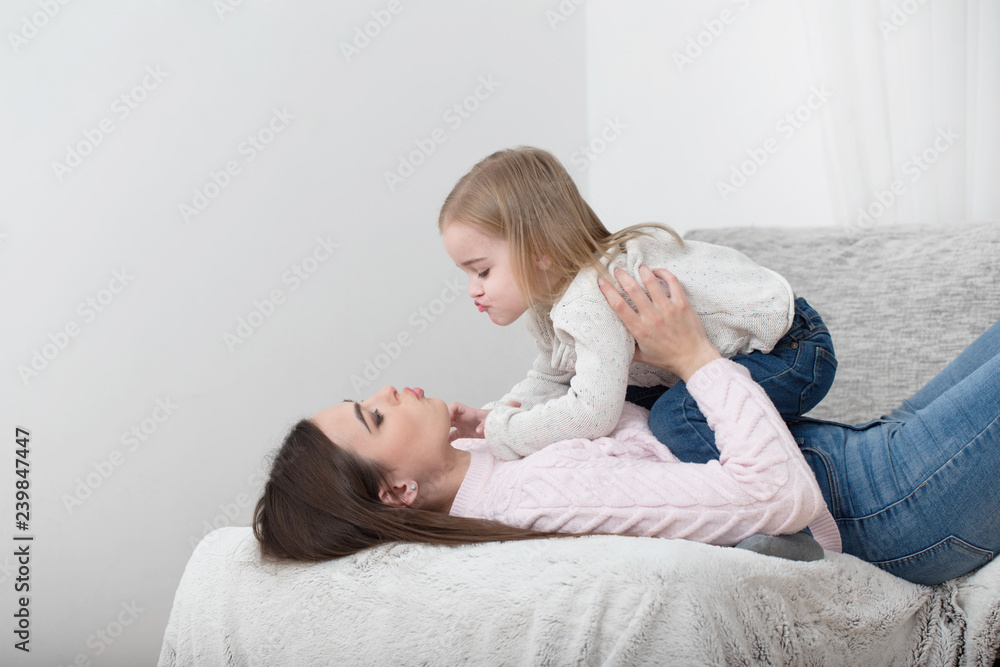 mother and daughter laugh together at home mother and daughter laugh together at home