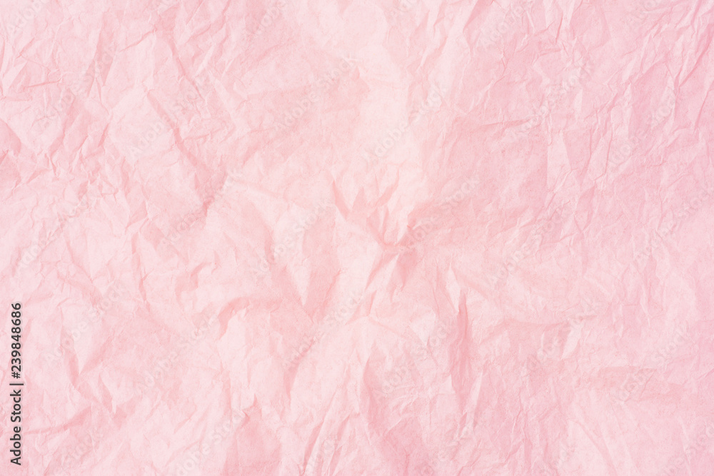 Crumpled pink paper or pink paper texture pattern background. Paper for  interior and exterior decoration or background for handcrafts. Abstract  rose paper background. Stock Photo