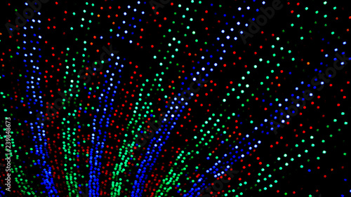 Background of colorful Christmas themed holiday light display with bokeh