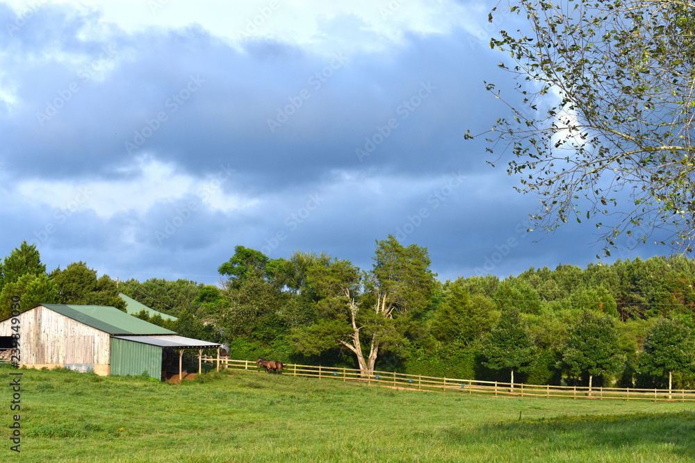 storm clouds over pasture with barn storm clouds over pasture with barn