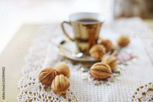 Traditional russian festive cookies  nuts  served with cofee in golden cup