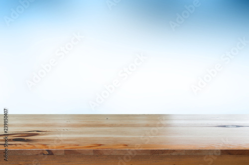 Empty desk with blue gradient blurred bokeh abstract background