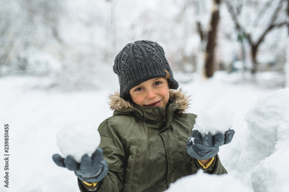 boy making snowball outdoor boy making snowball outdoor