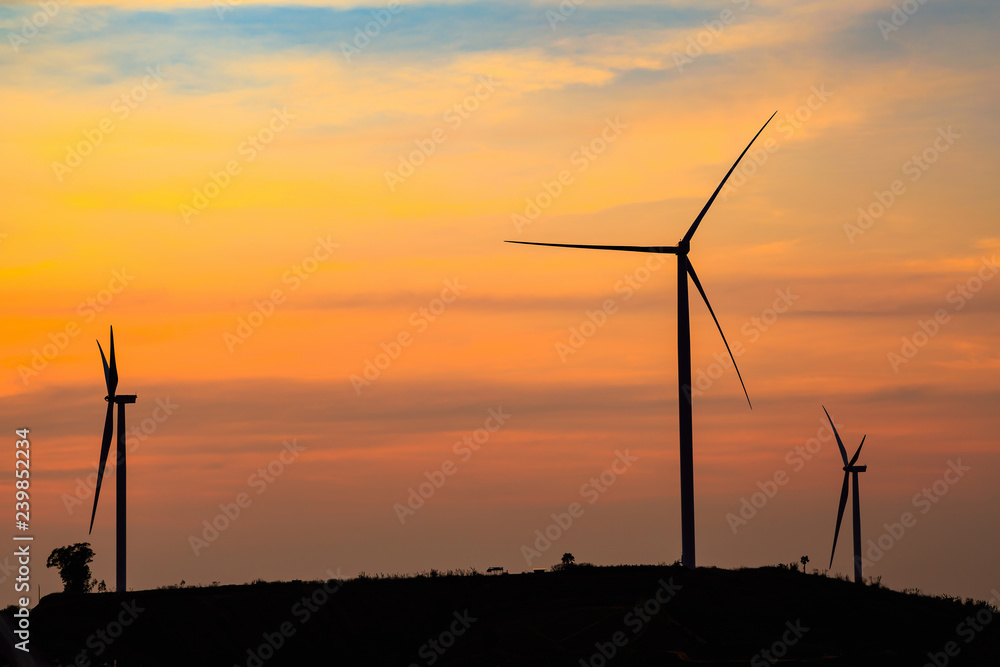 Silhouette of wind turbines farm Silhouette of wind turbines farm