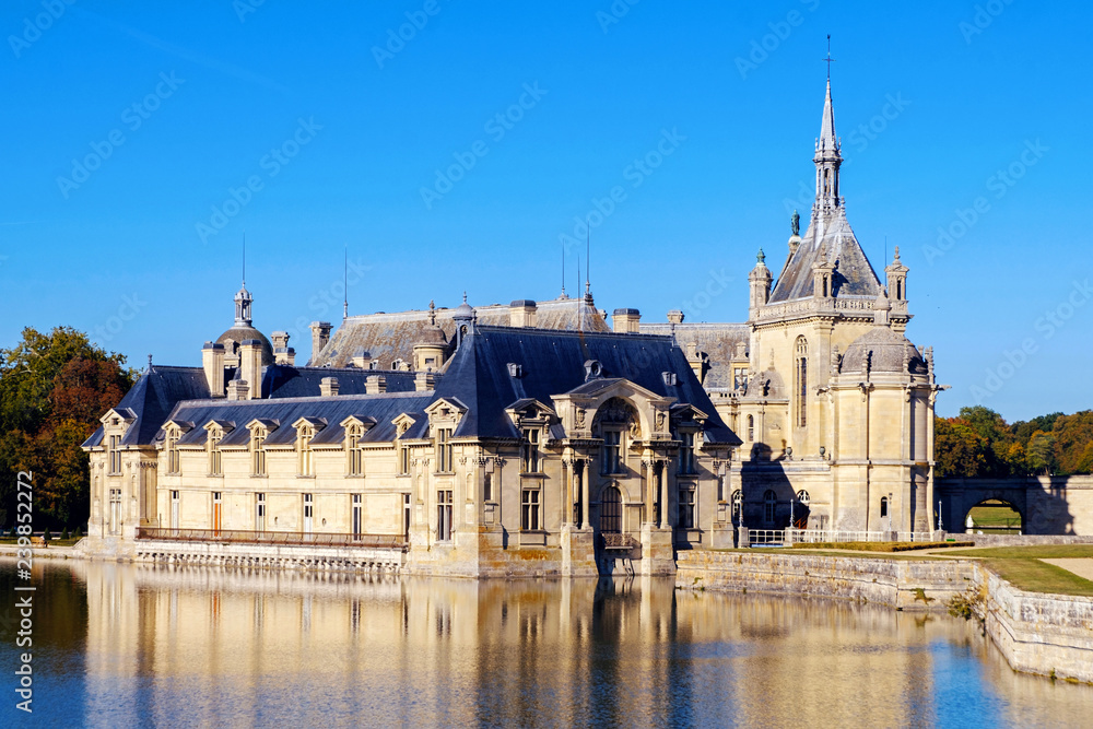 View of Chantilly castle with reflection View of Chantilly castle with reflection