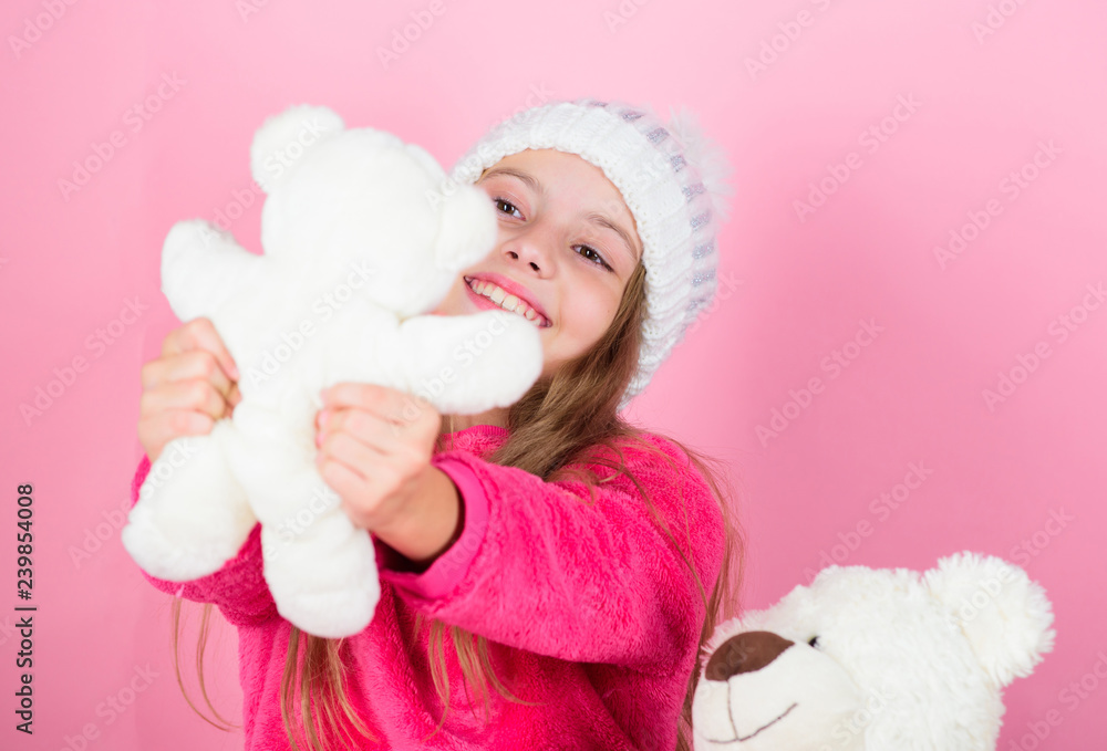 Child small girl playful hold teddy bear plush toy. Why kids love stuffed animals. Toy every child dreaming. Kid little girl play with soft toy teddy bear on pink background. Happy childhood concept Child small girl playful hold teddy bear plush toy. Why kids love stuffed animals. Toy every child dreaming. Kid little girl play with soft toy teddy bear on pink background. Happy childhood concept
