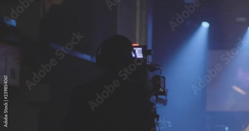 A Man Filming a Concert