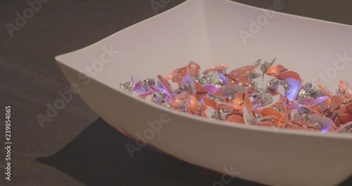 A Bunch of Pins Lighting Up in a Bowl