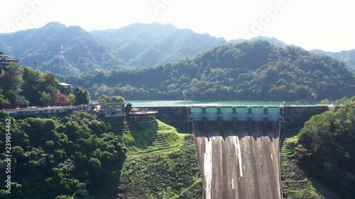 Aerial view of Shimen Reservoir spillway and dam, mountain surrounding, Taiwan, Asia.