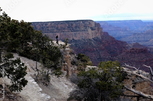Little specks in the distance are people standing of the edge of a cliff at the Grand Canyon