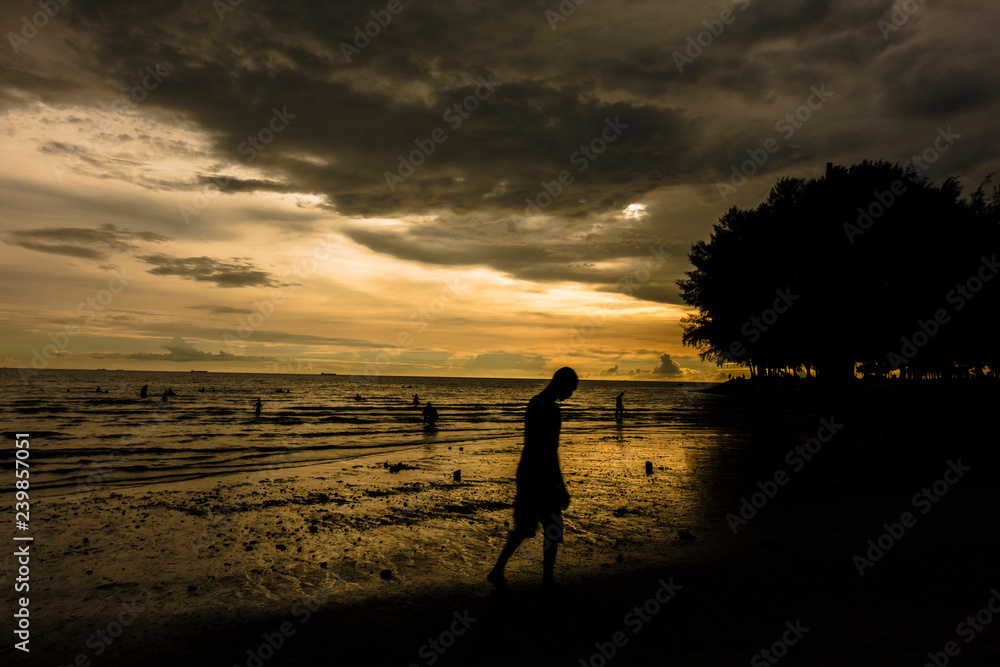 Obraz premium Unrecognizable people and Scenery sunset of Port Dickson beach in Negeri Sembilan