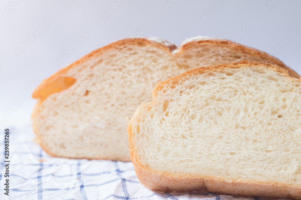 Fresh home made bread on white table background with napkin Fresh home made bread on white table background with napkin