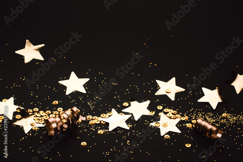 Golden stylish line of decoration on black background. Place for text. Festive concept.