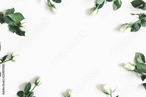 Flowers composition. White rose flowers on white background. Flat lay, top view, copy space