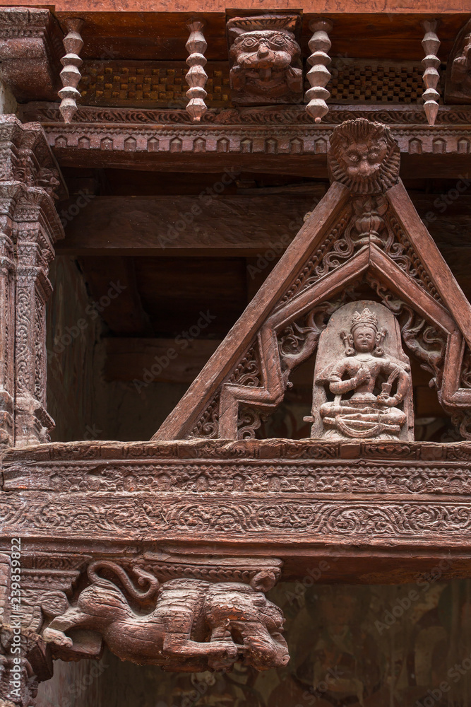 Ancient wooden carving on the entrance to Alchi monastery in Ladakh