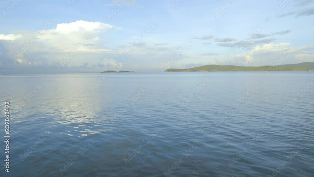 Panoramic shot starting from sea and ending on a fishing village on beach Panoramic shot starting from sea and ending on a fishing village on beach