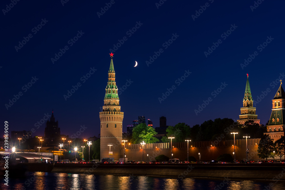 Night view of moscow kremlin with moon in the sky