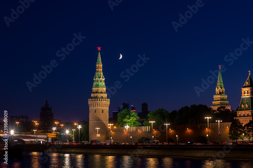 Night view of moscow kremlin with moon in the sky