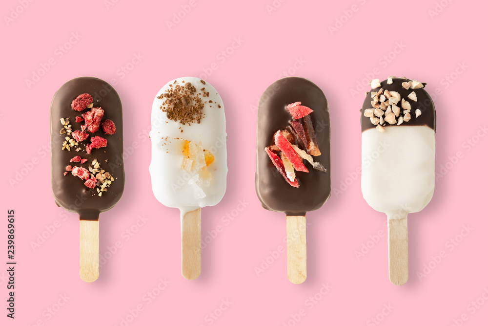 Different variants of cake popsice creams on pink background Different variants of cake popsice creams on pink background
