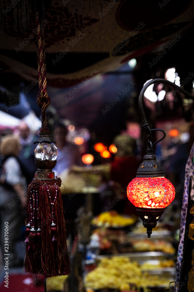 beautiful multicolored arabic lamps glowing at night in a market
