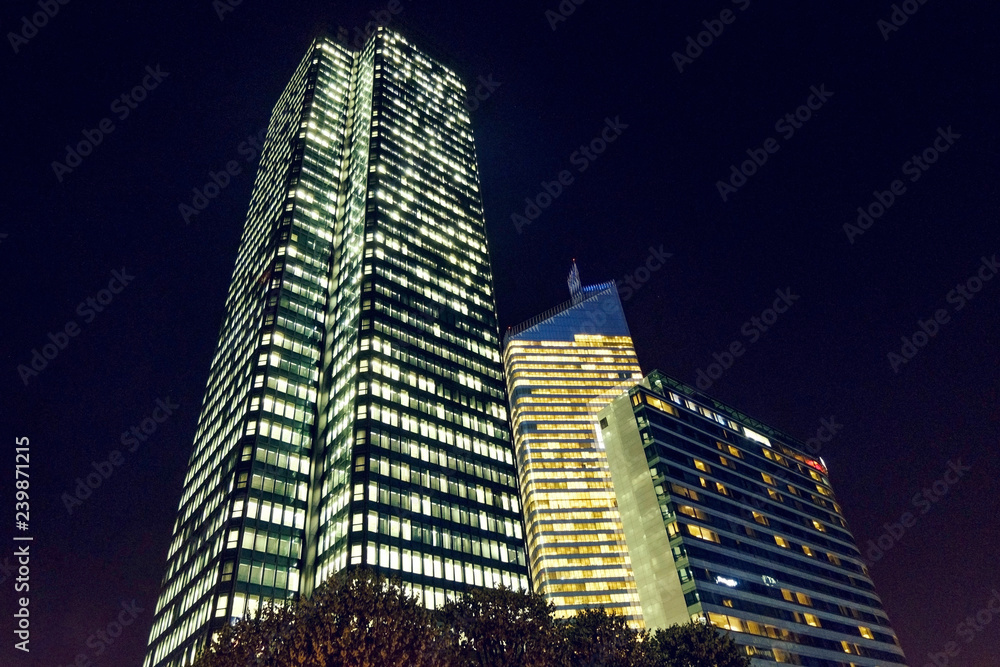 Paris city at night with business buildings
