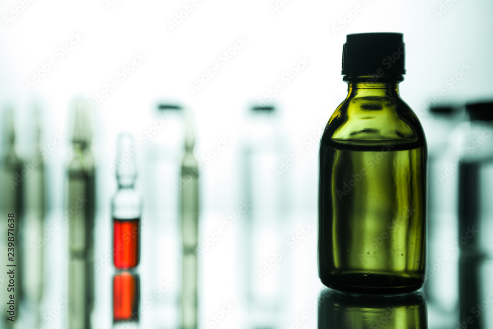 Group of ampoules with a transparent medicine in medical laboratory Group of ampoules with a transparent medicine in medical laboratory