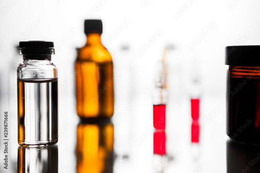 Group of ampoules with a transparent medicine in medical laboratory