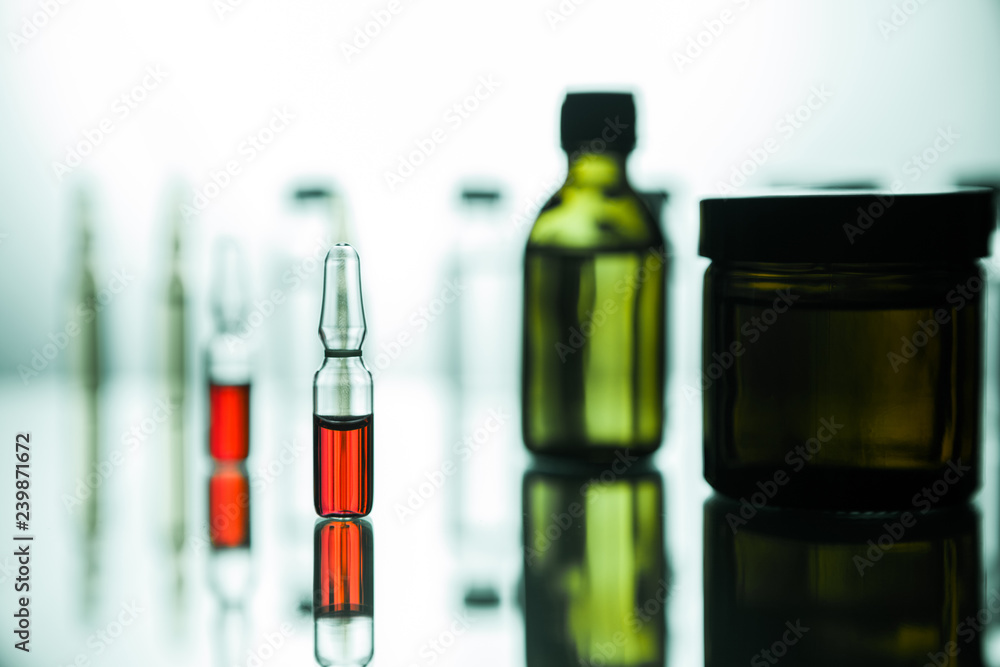 Group of ampoules with a transparent medicine in medical laboratory Group of ampoules with a transparent medicine in medical laboratory