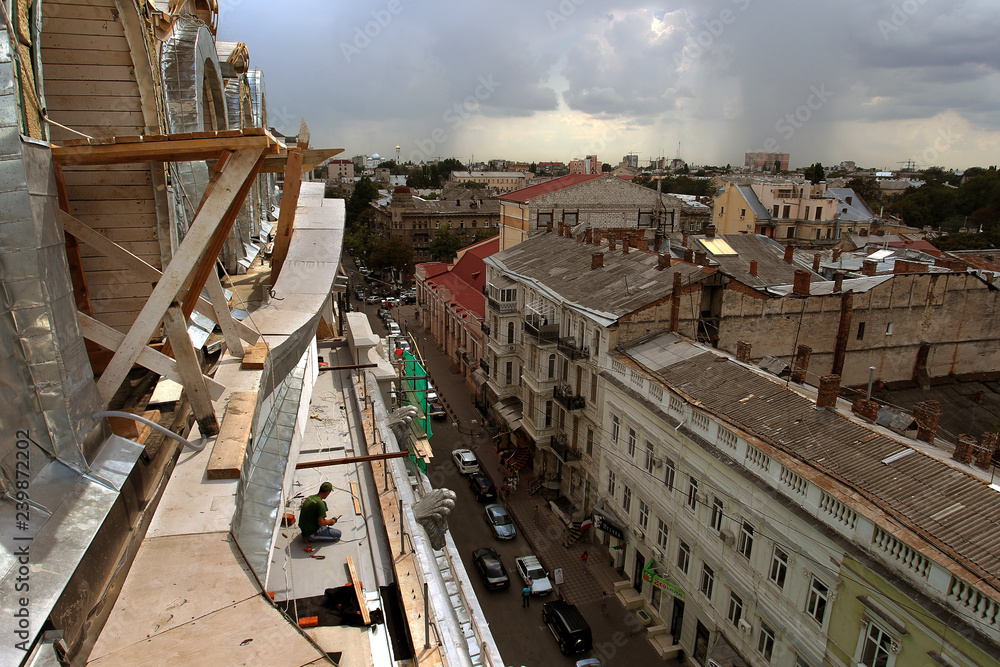 Odessa, Ukraine - CIRKA 2011: Urban scene, cityscape from a bird's eye view - built in the historic center of the city with slate and metal roofs of the old residential complex Odessa, Ukraine - CIRKA 2011: Urban scene, cityscape from a bird's eye view - built in the historic center of the city with slate and metal roofs of the old residential complex
