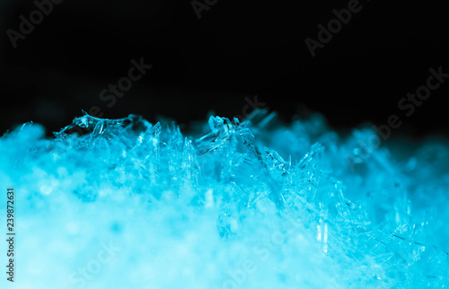 Abstract ice crystal structure texture, macro view. Cold concept, blue and black colors.