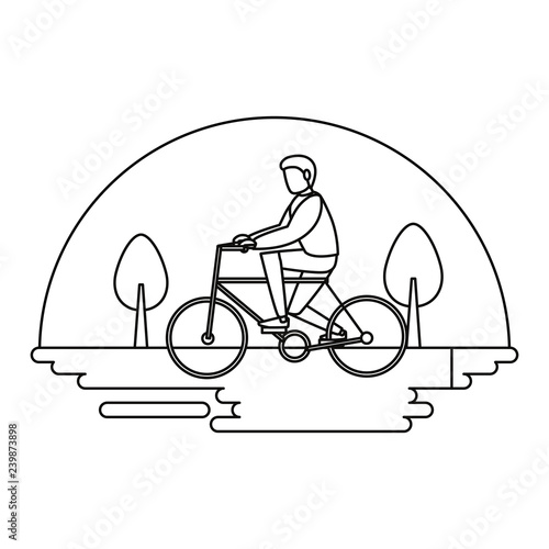 man riding bike outdoors image