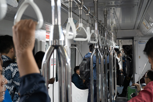 Jakarta, Indonesia - November 2018: People traveling inside monorail wagon in Asia