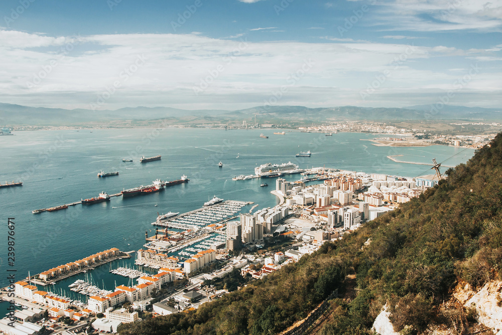 Panoramic view of Gibraltar taken from rock of Gibraltar mountain. Sunny cityscape background. 