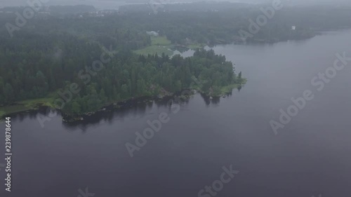 Aerial survey Mon Repos park in Old Vyborg, Russia, Monrepos north footage. Aerial footage forest panoramas foggy thick north forest, Island the Dead Mon Repos park. aerial video coniferous, pine tree photo