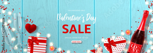 Valentine's Day holiday sale banner. Vector illustration with top view on realistic bottle of champagne, gift boxes, glasses of champagne, ring box and garlands with hearts on wooden texture.