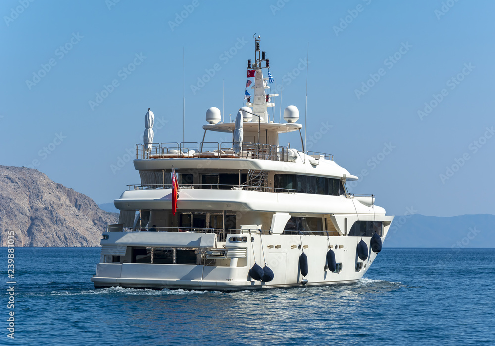 Yacht sailing off the coast of Symi island, Greece