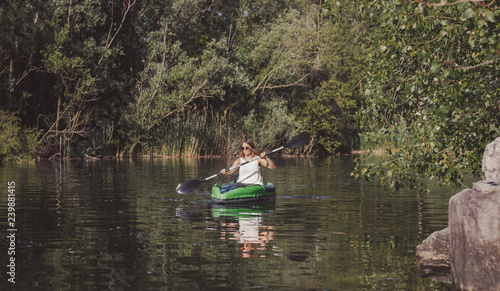 Young woman kayaking on the lake © NDStock