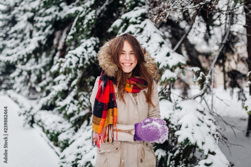 Beautiful young Caucasian people have the joy of happiness and fun in the winter in a snowy forest. Sculpt to make hands snowball gloves Beautiful young Caucasian people have the joy of happiness and fun in the winter in a snowy forest. Sculpt to make hands snowball gloves