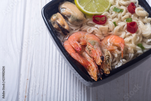 Instant noodles soup with shrimps and mssels . Asian food